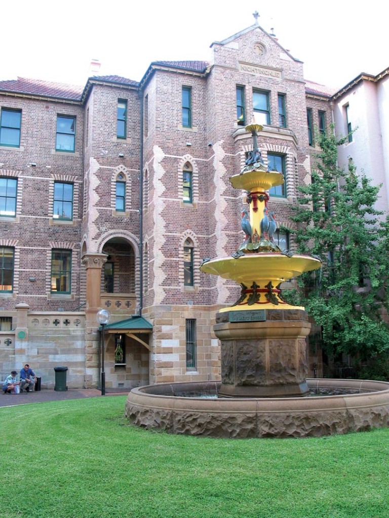 A tall, elegant fountain in the courtyard of Sydney Hospital