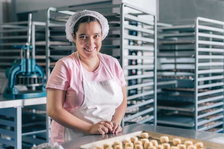 Volunteer with intelectual disability working at a Bakery 